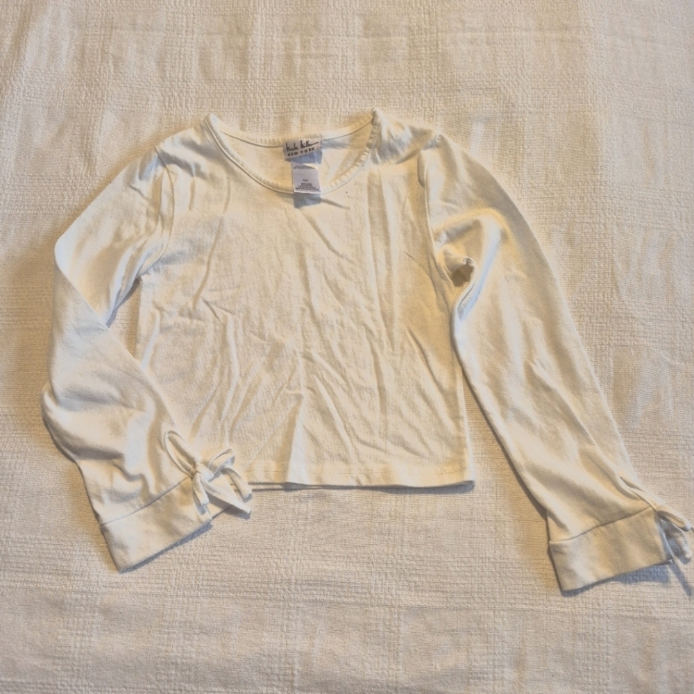 Nicole Miller girls size 6X white long sleeve cropped shirt, 2 marks on back